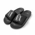 picknpack Armani Exchange black slide sandals with embossed metallic A|X logo on a contoured footbed