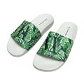 picknpack Armani Exchange slide sandals featuring a vibrant green botanical tropical print and white footbed.