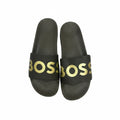 picknpack BOSS black pool slides with metallic gold logo print on the strap and contoured footbed