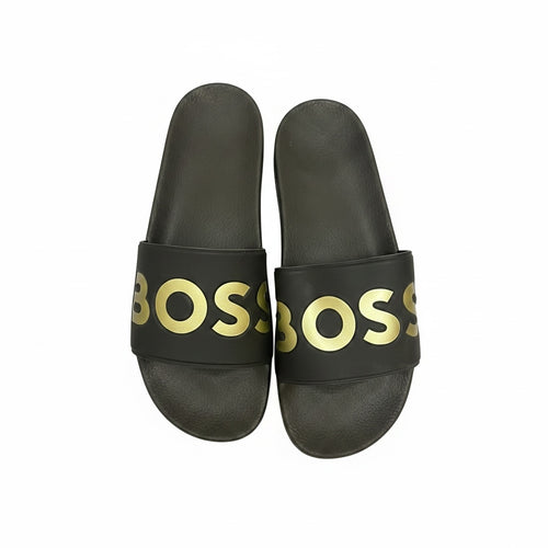 picknpack BOSS black pool slides with metallic gold logo print on the strap and contoured footbed