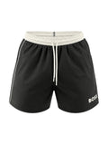 picknpack BOSS black swim shorts with a white elastic waistband, drawstring closure, and side piping detail.