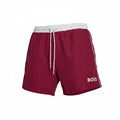 picknpack BOSS burgundy swim shorts with a white elastic drawstring waistband and side logo detail