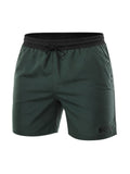 picknpack BOSS forest green swim shorts with a black elasticated waistband, drawstring closure, and leg logo branding.