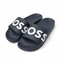 picknpack BOSS navy blue synthetic pool slides with a white logo print on the wide strap and a contoured footbed.