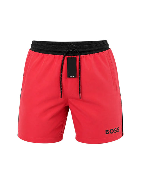 picknpack BOSS red swim shorts with a black elasticated drawstring waistband and logo detail on the leg.