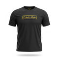 picknpack Calvin Klein black crew neck t-shirt with a bold gold-toned rectangular logo graphic on the chest.