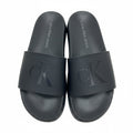 picknpack Calvin Klein Jeans black synthetic slide sandals with embossed logo on wide strap and contoured footbed