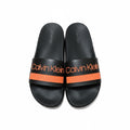 picknpack Calvin Klein black pool slide sandals with vibrant orange strap and logo branding on a contoured footbed