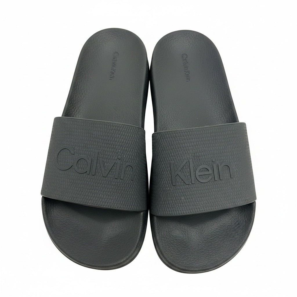 picknpack Calvin Klein black rubber slide sandals with embossed logo on textured straps and contoured footbeds