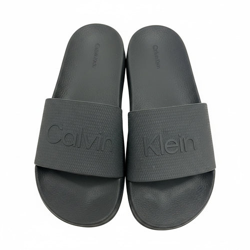 picknpack Calvin Klein black rubber slide sandals with embossed logo on textured straps and contoured footbeds