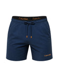 picknpack Calvin Klein navy swim shorts with an elastic waistband, drawstring, and orange logo detailing.