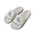 picknpack Calvin Klein Jeans off-white pool slides with a bold blue CK logo on the strap and contoured footbed