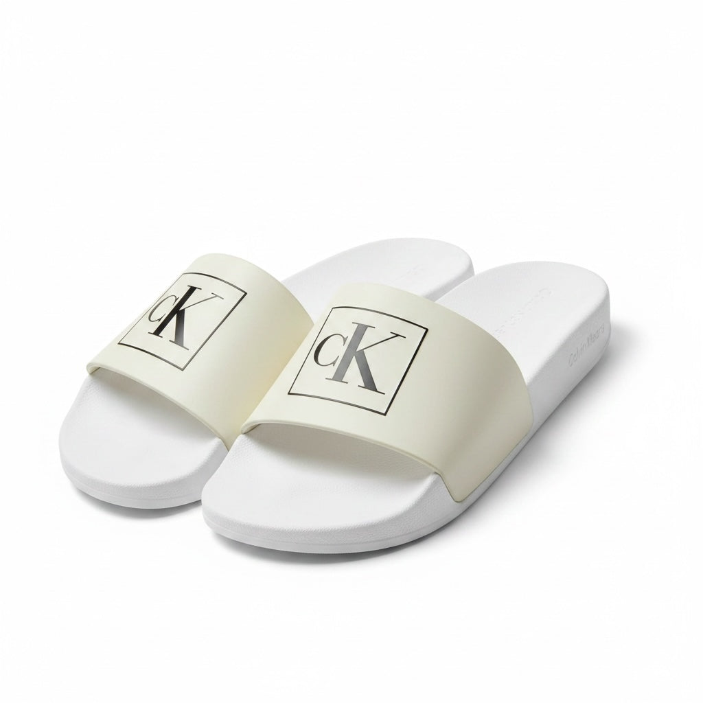 picknpack Calvin Klein white pool slide sandals with black logo on a wide strap and contoured footbed