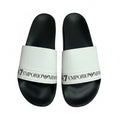 picknpack Emporio Armani slide sandals with white textured straps and black contoured footbeds featuring logo print