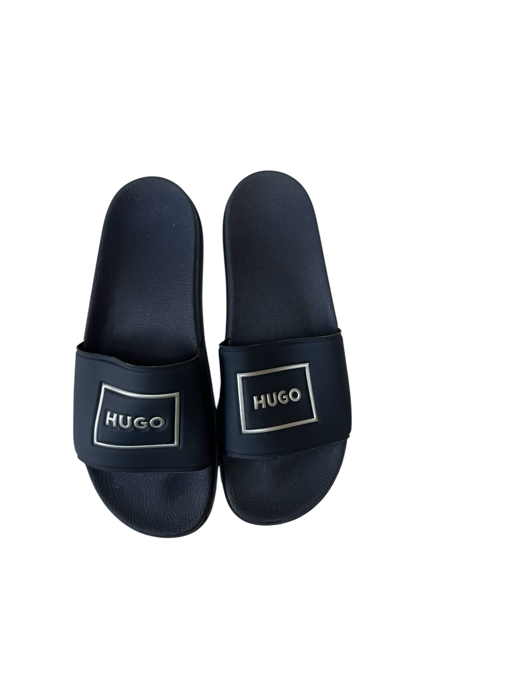 picknpack HUGO black slide sandals with a metallic silver-tone logo plaque on the strap and contoured footbed