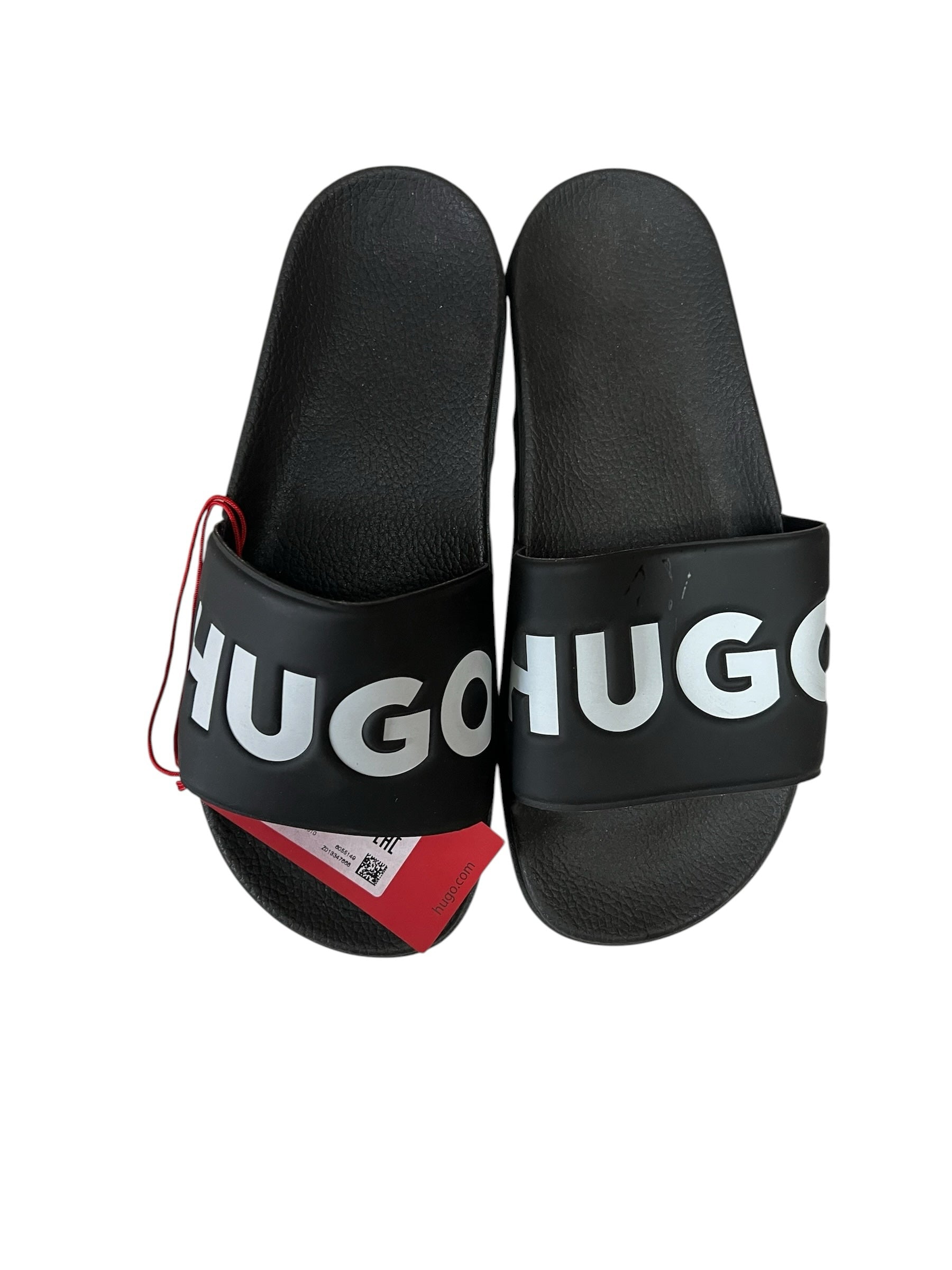 picknpack HUGO black rubber pool slides with bold white embossed logo on the strap and a red brand tag attached