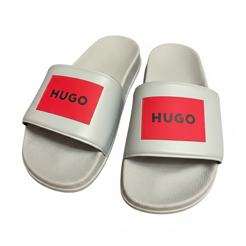 picknpack HUGO light grey pool slide sandals with a bold red rectangular logo patch and contoured footbed