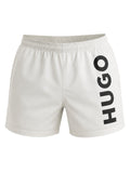 picknpack HUGO white swim shorts with bold black vertical logo print on the leg and elasticated drawstring waistband