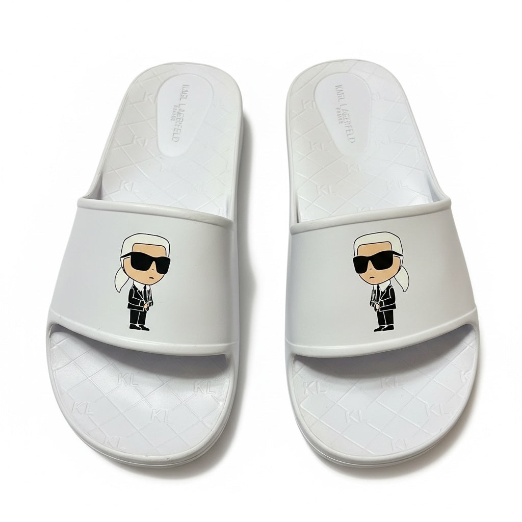picknpack white Karl Lagerfeld slide sandals featuring a signature character graphic on the strap and embossed footbed