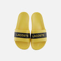 picknpack Lacoste yellow pool slide sandals with a black strap and prominent brand lettering