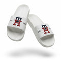 picknpack Tommy Hilfiger white pool slide sandals with navy and red TH monogram logo and EST 1985 detailing