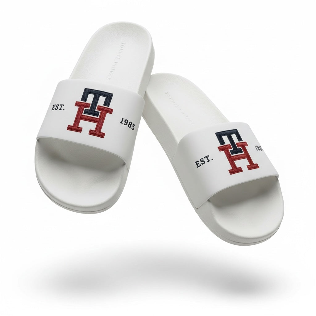 picknpack Tommy Hilfiger white pool slide sandals with navy and red TH monogram logo and EST 1985 detailing