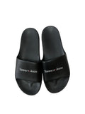 picknpack Tommy Jeans black synthetic pool slide sandals with a contoured footbed and white logo on the wide strap