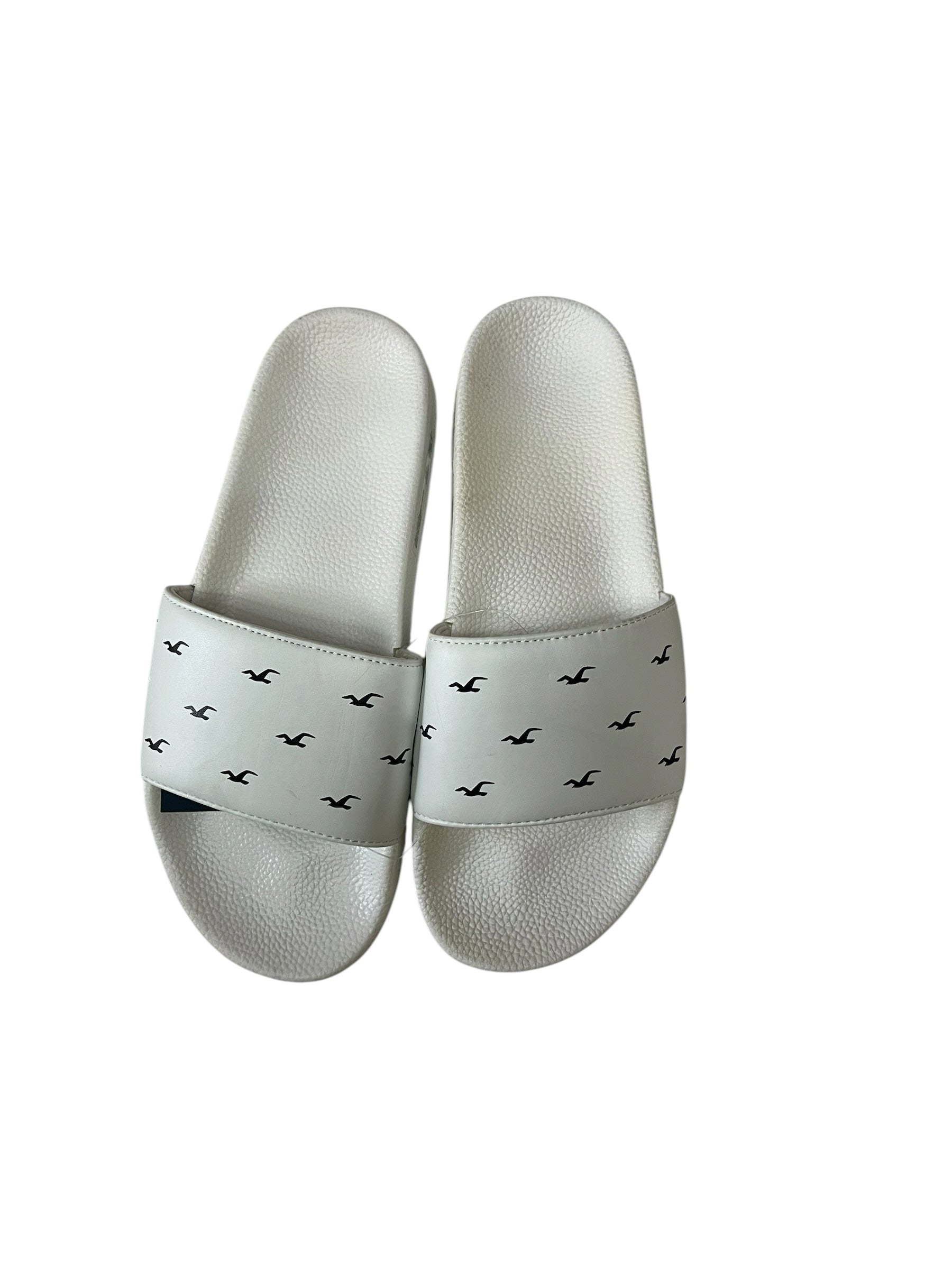 picknpack white slide sandals with repeating black bird logo pattern and contoured footbed for casual summer wear