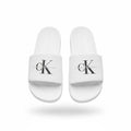 picknpack white Calvin Klein Jeans pool slide sandals with black logo on the strap and contoured footbed